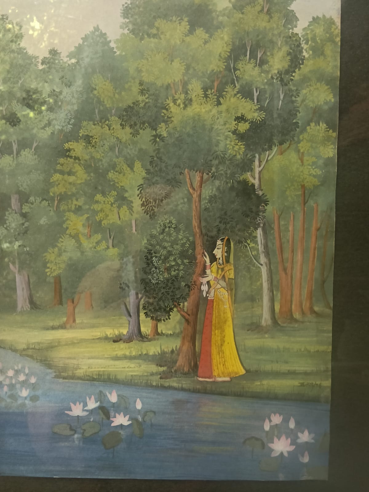 Lady standing near lake