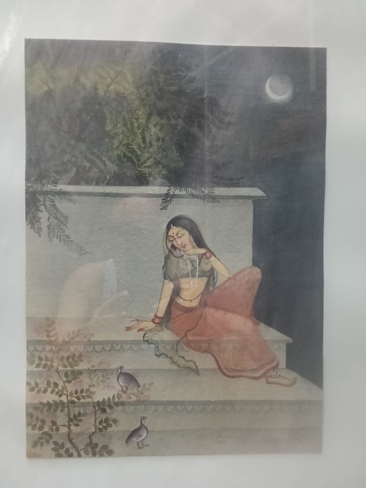 Lady sitting in moon light